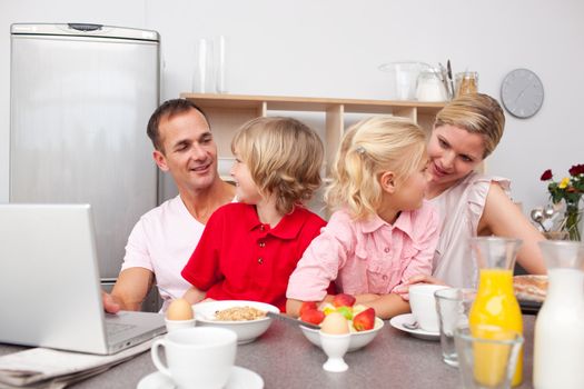 Lively family having breakfast together 