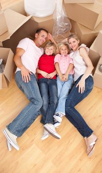 Smiling family while moving house
