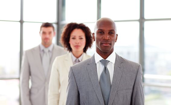 Serious African-American businessman leading his colleagues