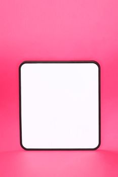 Whiteboard sign on pink background