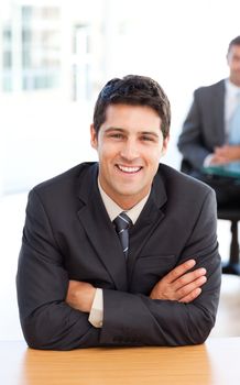 Delighted businessman in the foreground during a meeting with a 