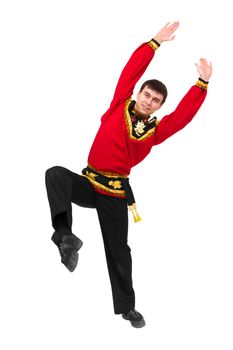 young man wearing a folk russian costume dancing against isolated white background