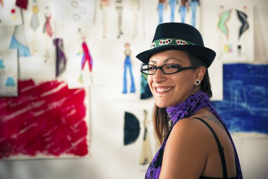 Portrait of happy woman working as fashion designer