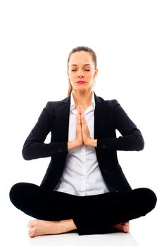 Young businesswoman doing yoga on white background studio
