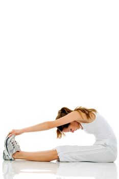 Young woman doing gymnastics on white background studio