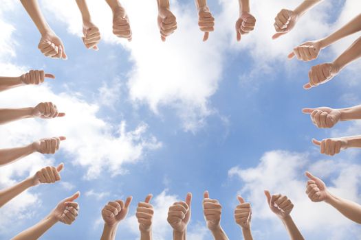 group of people with thumbs up on cloud background