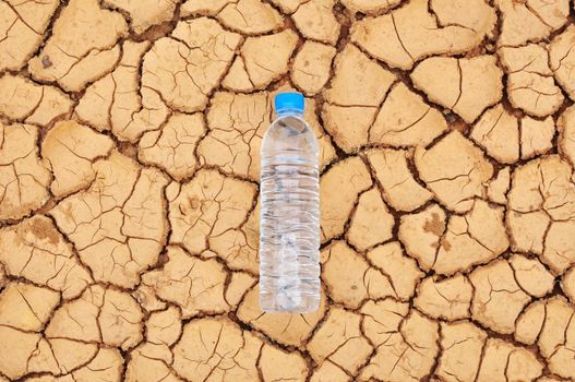 drinking water bottle on arid background