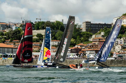 Participants compete in the Extreme Sailing Series