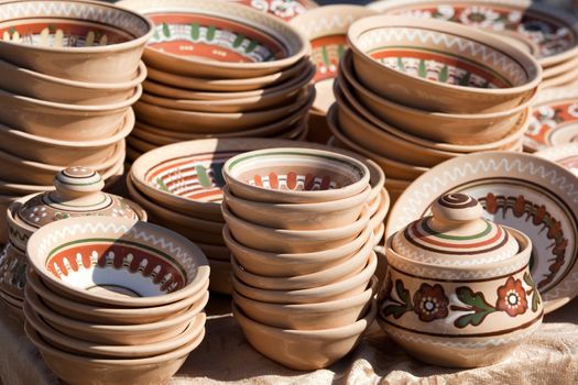 Stack of decorated handmade ceramic ware at the handicraft marke