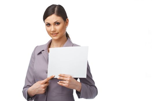 Portrait of a young business woman pointing on the paper she is holding