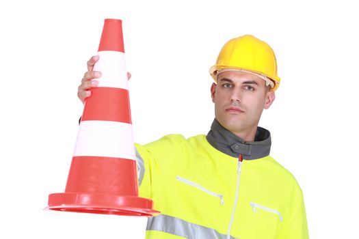 Worker with a traffic cone