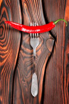 Red chili pepper and fork