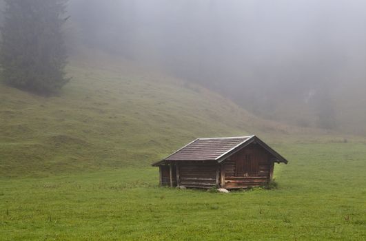 wooden hut on alpine meadows