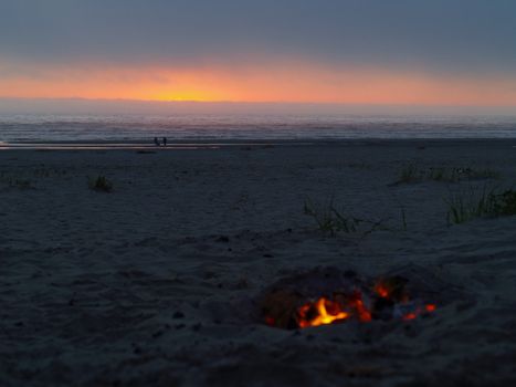 Beach Campfire at Dusk with Ocean in the background