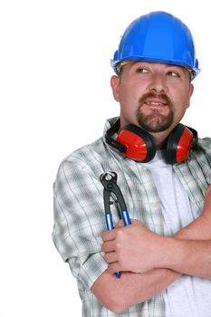 Tradesman holding a pair of pliers