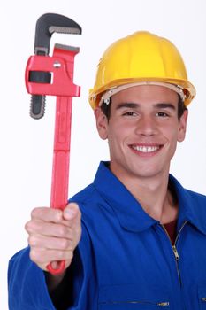 Young man holding wrench