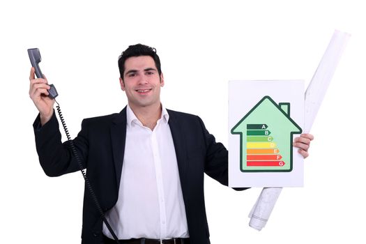 commercial agent holding an energy consumption label and a phone