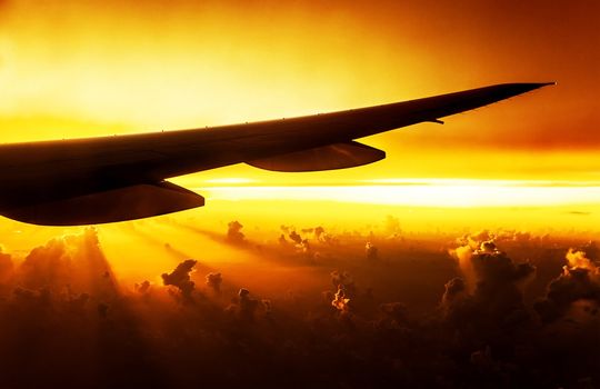 Airplane on sunset