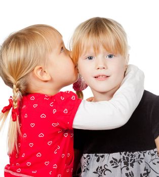 Little girls sharing a secret