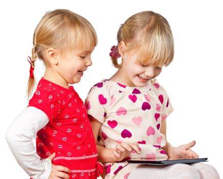 Girls playing with a tablet computer 