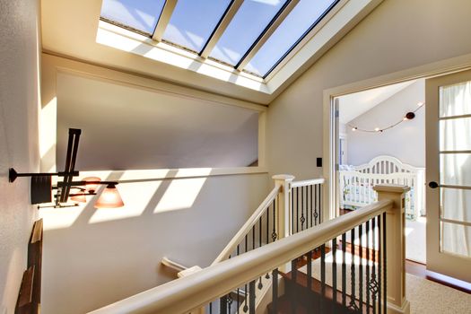 Staircase with skylight and baby room.
