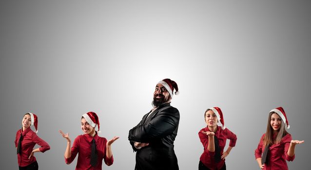 business santa claus and his christmas assistant girls