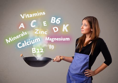 Young woman cooking vitamins and minerals