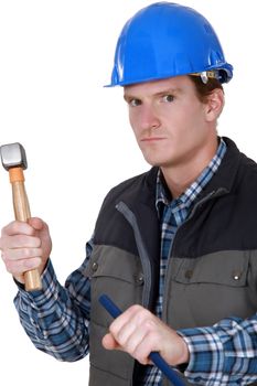 Angry builder with hammer and chisel
