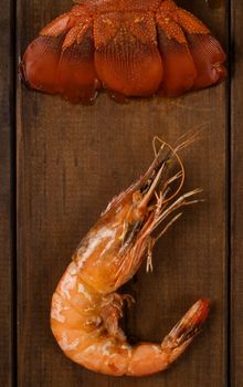 Crayfish tail and prawn on table