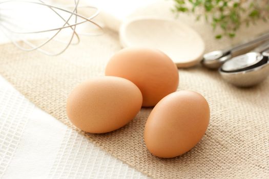 Eggs with kitchen utensils