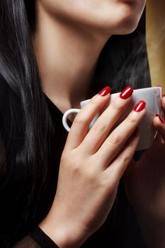 Woman Holding a Hot Beverage