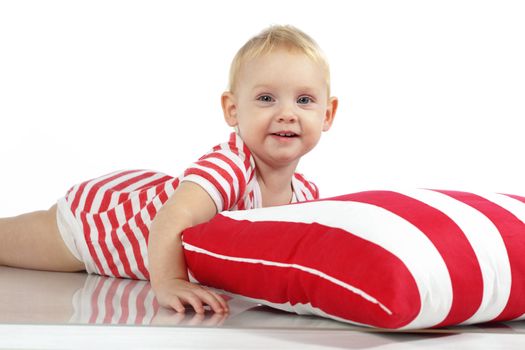 Child lying with pillow