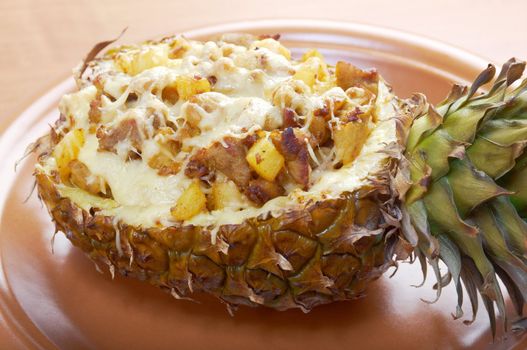 roast meat with cheese  grilled  in pineapple