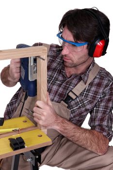 Man building a wooden frame