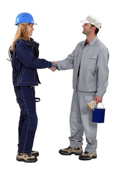 A painter and an electrician shaking hands.