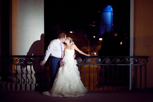 bride and girl kissing outdoors at night