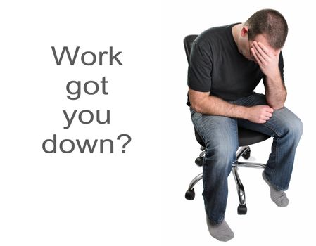 A depressed man is sitting in an office chair, isolated on a white background.