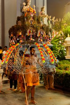 Devotee carrying a kavadi at Thaipusam in Singapore EDITORIAL US