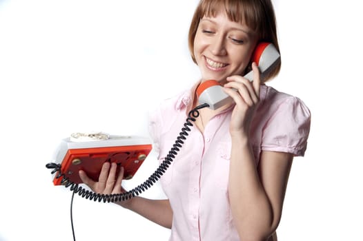 young girl talking on old phone
