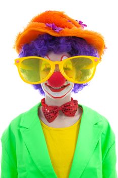 portrait of child dressed as colorful funny clown with balloons over white background