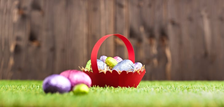 Red basket with Chocolate Easter eggs 