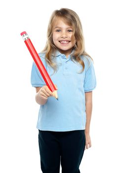 Charming kid with beautiful hair holding red pencil