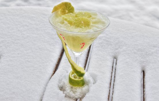 Decorated frozen marguerita drink on a bed of snow