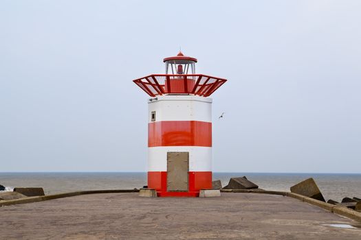 red and white lighthouse in the Hague, Holland