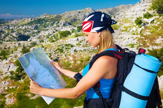 Traveling woman looking in map