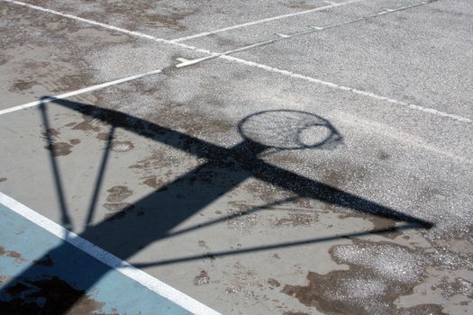 Urban basketball hoop shadow