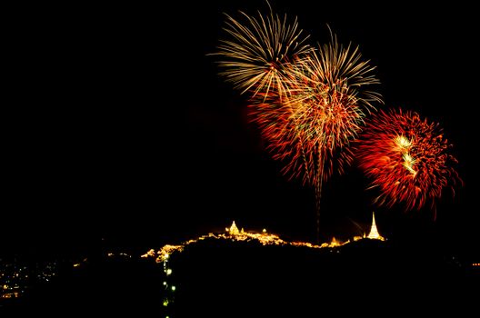 fireworks display above Thai temple on the hill