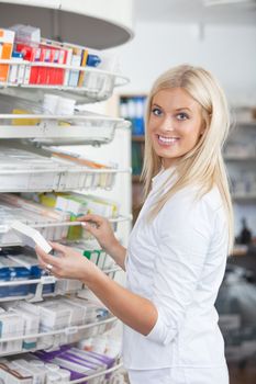 Woman Standing in Pharmacy Drugstore