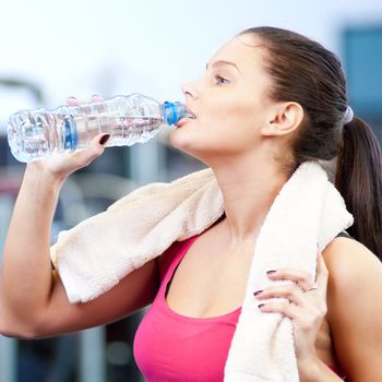 Man and woman drinking water after sports