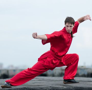 Wushoo man in red practice martial art